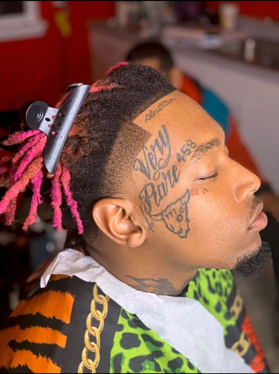 Locs with a taper and razor-sharp edge, cut by Ben Zweifel